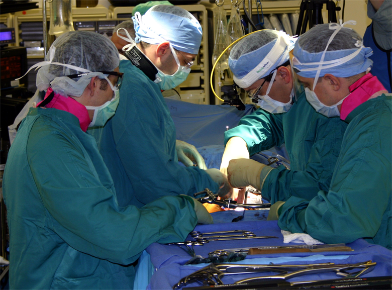 Surgeons work on rotator cuff injury