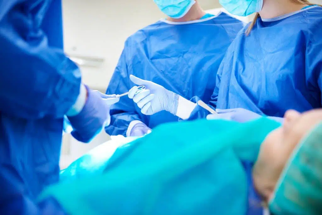 Patient in surgery with a group of surgeons in Torrance.