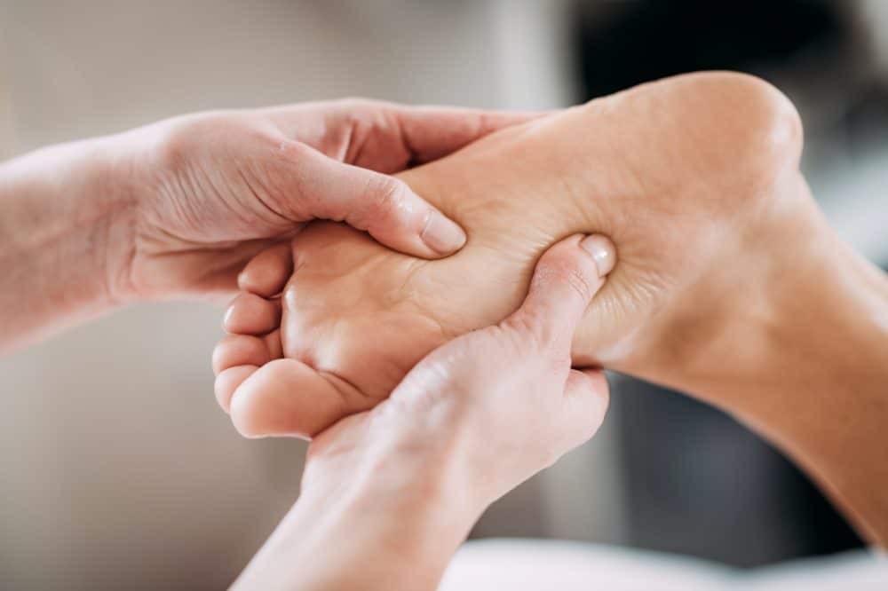 doctor examining patients foot