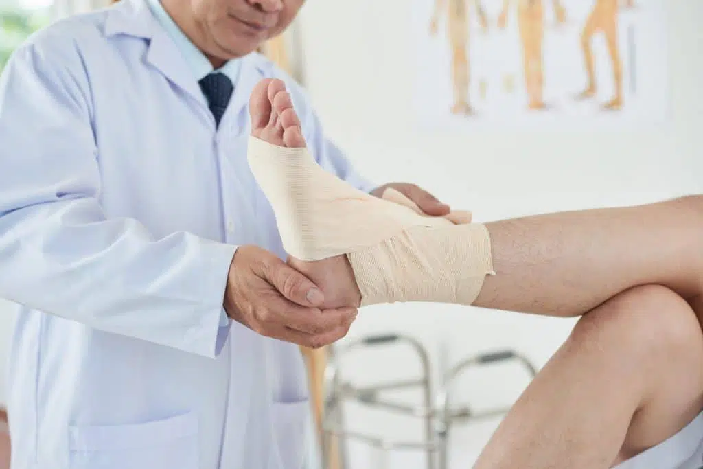 Foot pain specialist examining patient's foot.