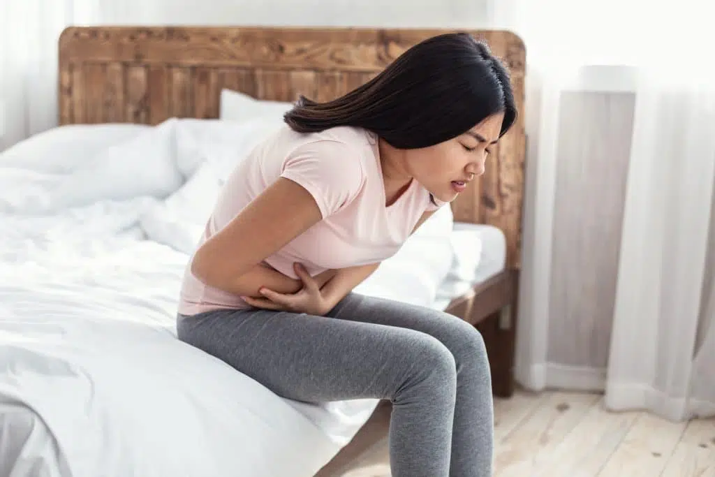 Woman having stomachache caused by hernia.