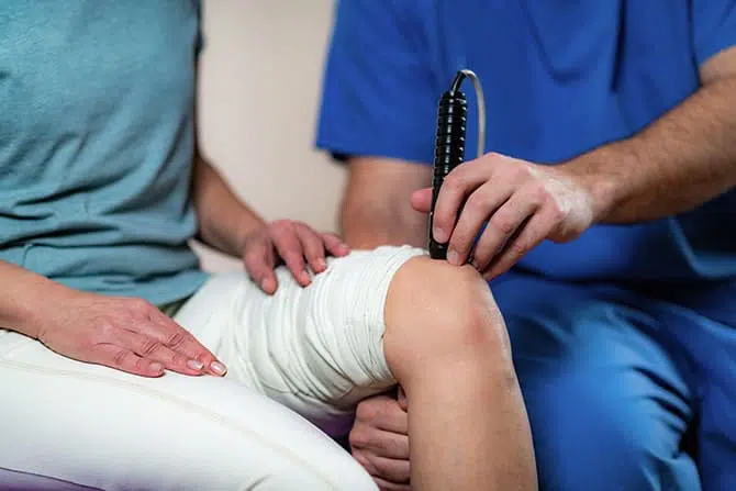 Patient receiving laser physical therapy in Torrance.